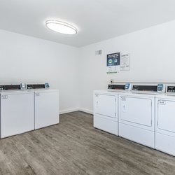 Laundry facility Leasing office interiors atThe Carlson in Colorado Springs, CO